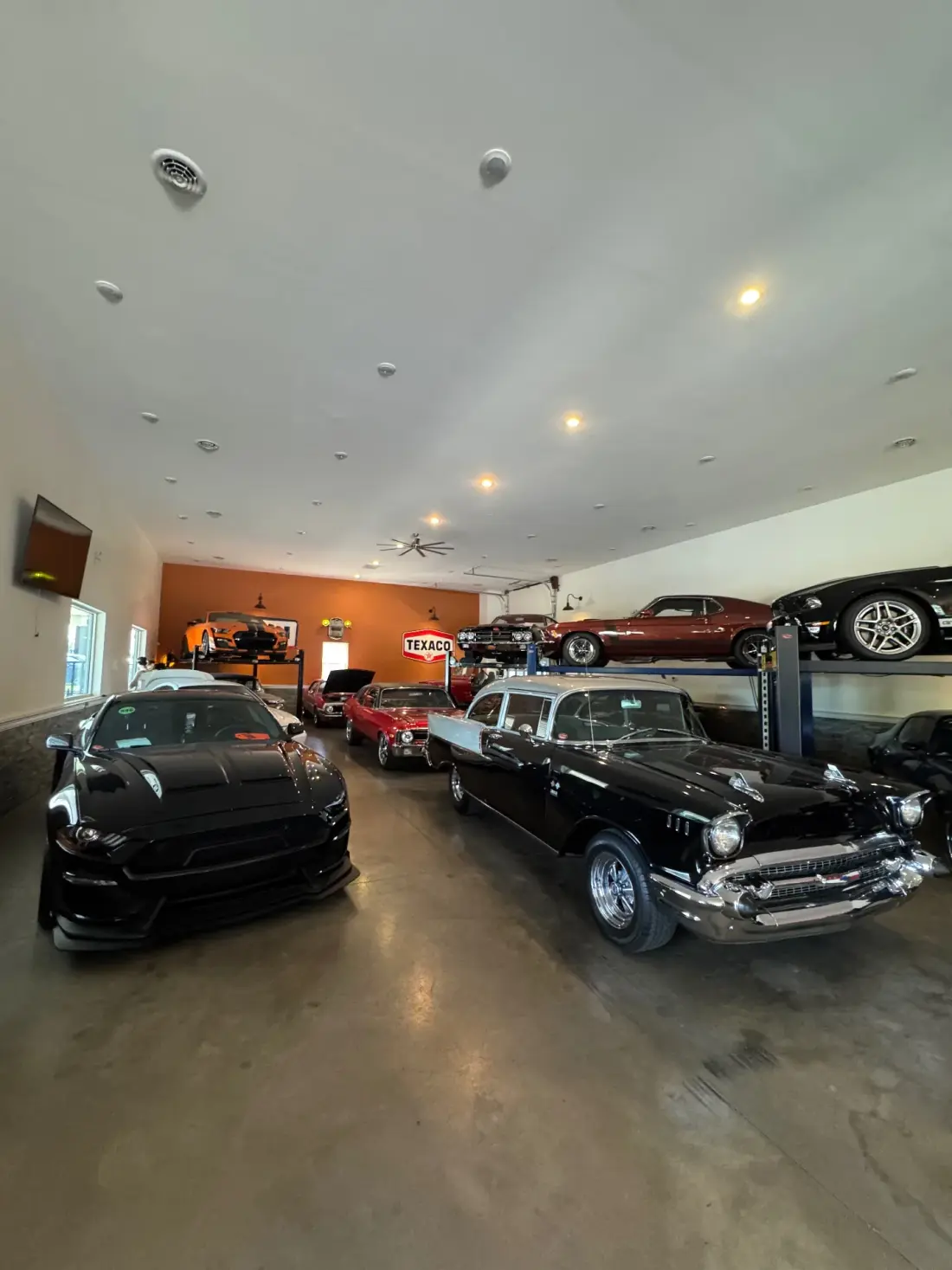Inside The Speed Shop showroom with classic muscle cars on display
